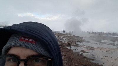 photo of my forehead and a geyser in the background